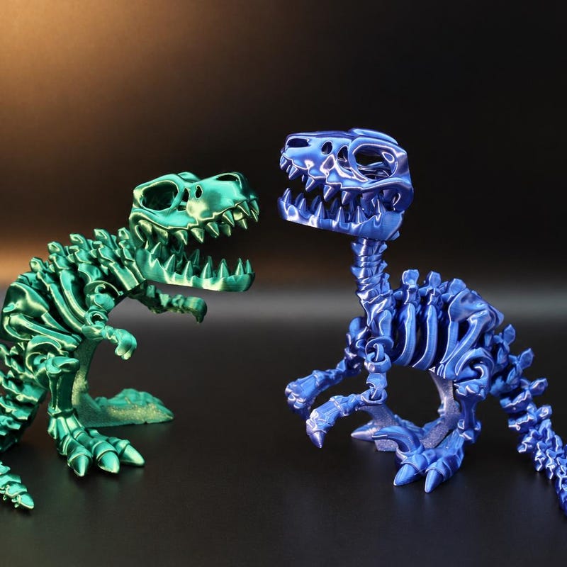 GallantPNW green T. Rex and blue raptor skeletons